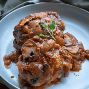 pollo con tomate y champiñones